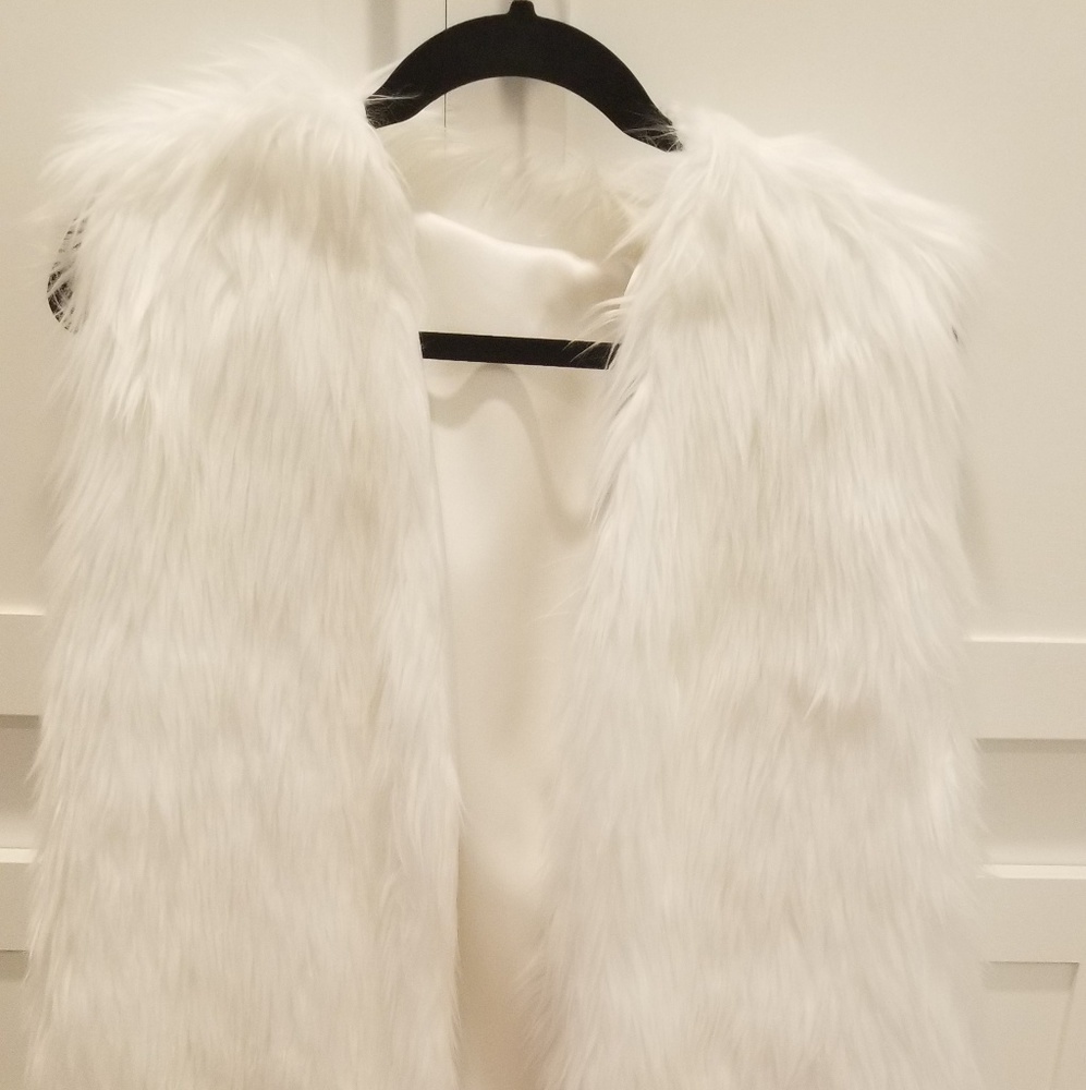White fur long vest.  Fur not real.